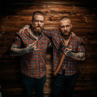 Two mans with beards and tattoo.